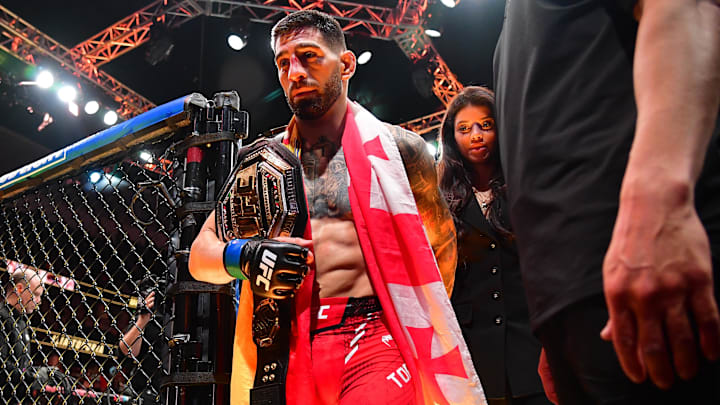 Feb 17, 2024; Anaheim, California, USA; Ilia Topuria celebrates his championship victory against