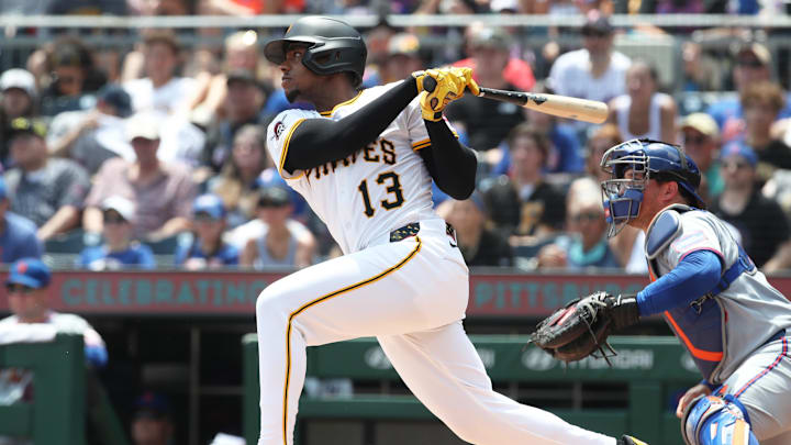 Jun 29, 2025; Pittsburgh, Pennsylvania, USA;  Pittsburgh Pirates third baseman Ke'Bryan Hayes (13) hits a two run single against the New York Mets during the first inning at PNC Park. Mandatory Credit: Charles LeClaire-Imagn Images