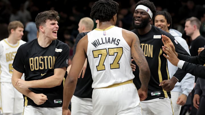 Jan 23, 2026; Brooklyn, New York, USA; Boston Celtics guard Hugo Gonzalez (28) and forward Amari Williams (77) and center Neemias Queta (88) celebrate after defeating the Brooklyn Nets in double overtime at Barclays Center. Mandatory Credit: Brad Penner-Imagn Images