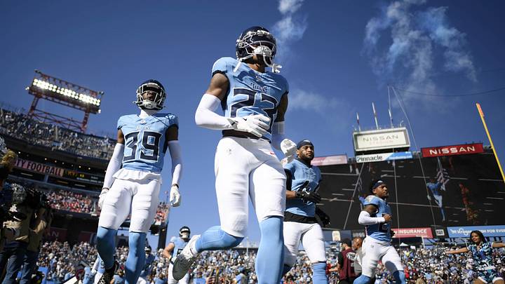 Nov 16, 2025; Nashville, Tennessee, USA; Tennessee Titans safety Kevin Winston Jr. (23) and cornerback Darrell Baker Jr. (39) run onto the field before the game against the Houston Texans at Nissan Stadium. Mandatory Credit: Steve Roberts-Imagn Images