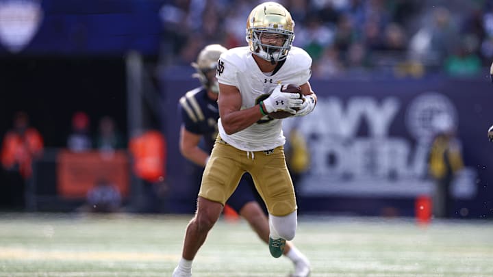 Oct 26, 2024; East Rutherford, New Jersey, USA; Notre Dame Fighting Irish wide receiver Jordan Faison (6) gains yards after catch during the first half against the Navy Midshipmen at MetLife Stadium. Mandatory Credit: Vincent Carchietta-Imagn Images