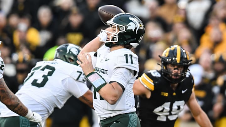 Nov 22, 2025; Iowa City, Iowa, USA; Michigan State Spartans quarterback Alessio Milivojevic (11) throws a pass against the Iowa Hawkeyes during the second quarter at Kinnick Stadium. Mandatory Credit: Jeffrey Becker-Imagn Images Nov 22, 2025; Iowa City, Iowa, USA; Michigan State Spartans quarterback Alessio Milivojevic (11) throws a pass against the Iowa Hawkeyes during the second quarter at Kinnick Stadium. Mandatory Credit: Jeffrey Becker-Imagn Images