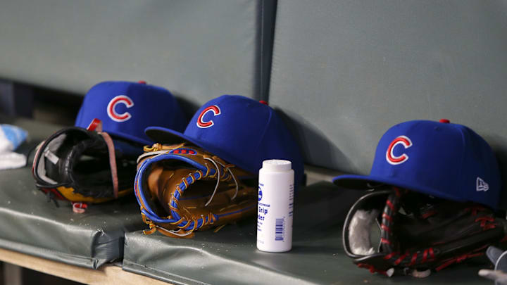 Apr 3, 2019; Atlanta, GA, USA; Detailed view of Chicago Cubs hats and gloves in the dugout against the Atlanta Braves in the fifth inning at SunTrust Park. Mandatory Credit: Brett Davis-Imagn Images
