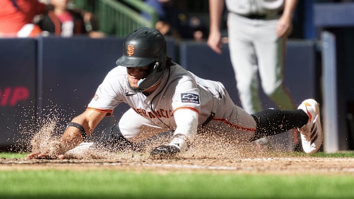 Aug 24, 2025; Milwaukee, Wisconsin, USA;  San Francisco Giants right fielder Luis Matos (29) scores a run during the ninth inning against the Milwaukee Brewers at American Family Field. Mandatory Credit: Jeff Hanisch-Imagn Images