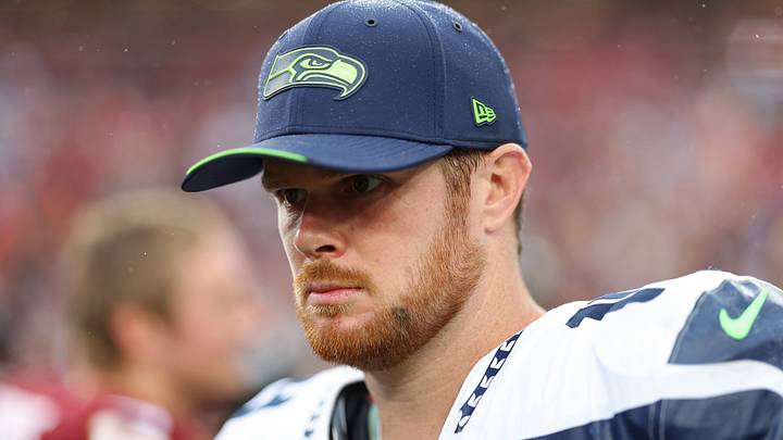 Seattle Seahawks quarterback Sam Darnold stands on the field after the game against the Washington Commanders. Seattle Seahawks quarterback Sam Darnold stands on the field after the game against the Washington Commanders.