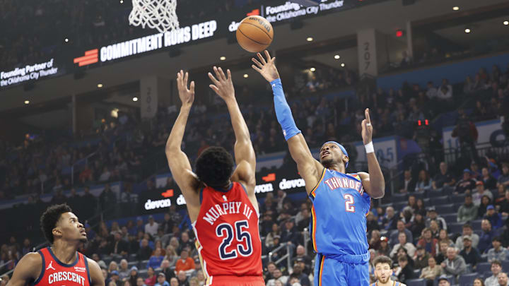 Feb 10, 2025; Oklahoma City, Oklahoma, USA; Oklahoma City Thunder guard Shai Gilgeous-Alexander (2) shoots as New Orleans Pelicans guard Trey Murphy III (25) defends during the first quarter at Paycom Center. Mandatory Credit: Alonzo Adams-Imagn Images