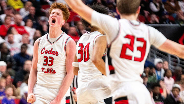 Cedar Fall's Leyton Wolf (33) celebrates a three-pointer in the fourth quarter against Johnston on March 13, 2026, at Casey’s Center in Des Moines.