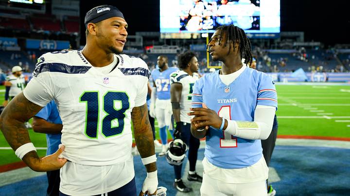 Tennessee Titans quarterback Cam Ward (1) and Seattle Seahawks tight end Elijah Arroyo (18) talk post game.