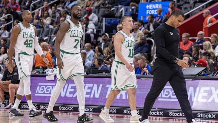 Oct 26, 2024; Detroit, Michigan, USA; Boston Celtics head coach Joe Mazzulla walks back to his bench in front of guard Payton Pritchard (11), guard Jaylen Brown (7) and center Al Horford (42) during the second half of the game against the Detroit Pistons at Little Caesars Arena. Mandatory Credit: David Reginek-Imagn Images