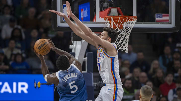 Jan 20, 2024; Minneapolis, Minnesota, USA; Minnesota Timberwolves guard Anthony Edwards (5) drives to the basket as Oklahoma City Thunder forward Chet Holmgren (7) plays defense in the first half at Target Center. Mandatory Credit: Jesse Johnson-Imagn Images