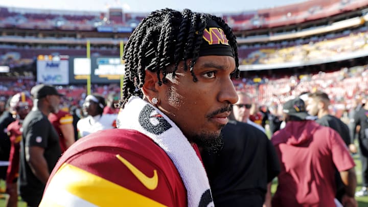 Oct 6, 2024; Landover, Maryland, USA; Washington Commanders quarterback Jayden Daniels (5) walks off the field after defeating the Cleveland Browns at NorthWest Stadium. Mandatory Credit: Peter Casey-Imagn Images