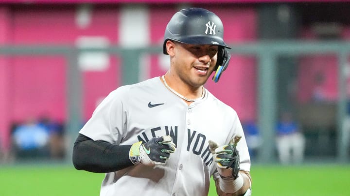 Jun 12, 2024; Kansas City, Missouri, USA; New York Yankees second baseman Gleyber Torres (25) celebrates while running the bases after hitting a three run home run against the Kansas City Royals in the seventh inning at Kauffman Stadium. Mandatory Credit: Denny Medley-USA TODAY Sports