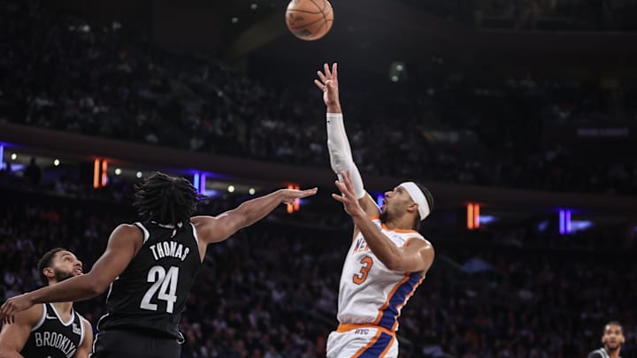 Nov 17, 2024; New York, New York, USA;  New York Knicks guard Josh Hart (3) shoots over Brooklyn Nets guard Cam Thomas (24) in the fourth quarter at Madison Square Garden. Mandatory Credit: Wendell Cruz-Imagn Images