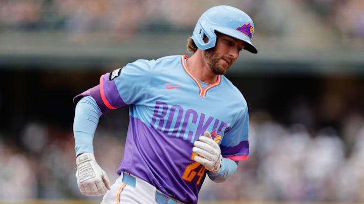 Former Colorado Rockies third baseman Ryan McMahon (24) rounds the bases on a two run home run in the first inning against the Minnesota Twins at Coors Field. 