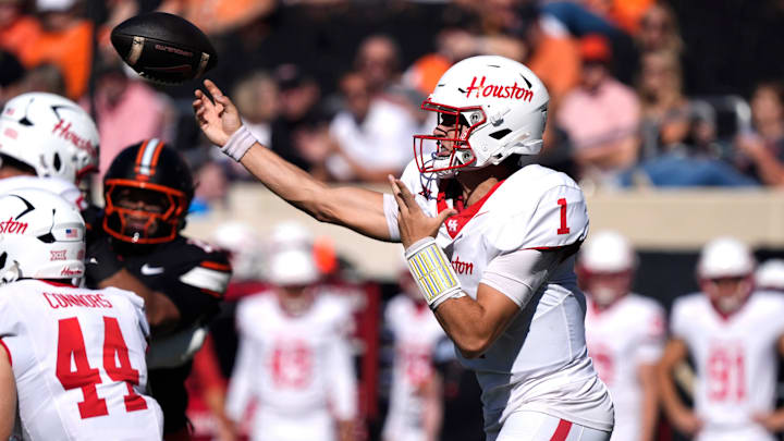 Houston Cougars quarterback Conner Weigman (1) throws a pass during a college football game between the Oklahoma State Cowboys (OSU) and the Houston Cougars at Boone Pickens Stadium in Stillwater, Okla., Saturday, Oct. 11, 2025. Houston Cougars quarterback Conner Weigman (1) throws a pass during a college football game between the Oklahoma State Cowboys (OSU) and the Houston Cougars at Boone Pickens Stadium in Stillwater, Okla., Saturday, Oct. 11, 2025.