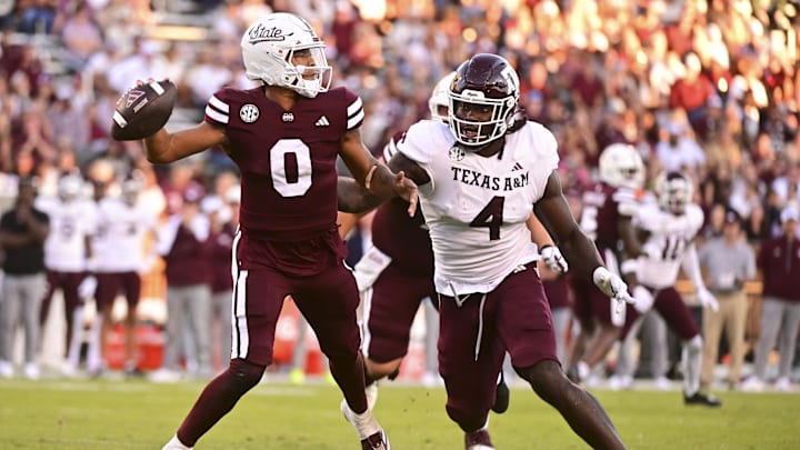 Oct 19, 2024; Starkville, Mississippi, USA;Mississippi State Bulldogs quarterback Michael Van Buren Jr. (0) drops back to pass against Texas A&M Aggies defensive lineman Shemar Stewart (4) during the third quarter at Davis Wade Stadium at Scott Field. Mandatory Credit: Matt Bush-Imagn Images