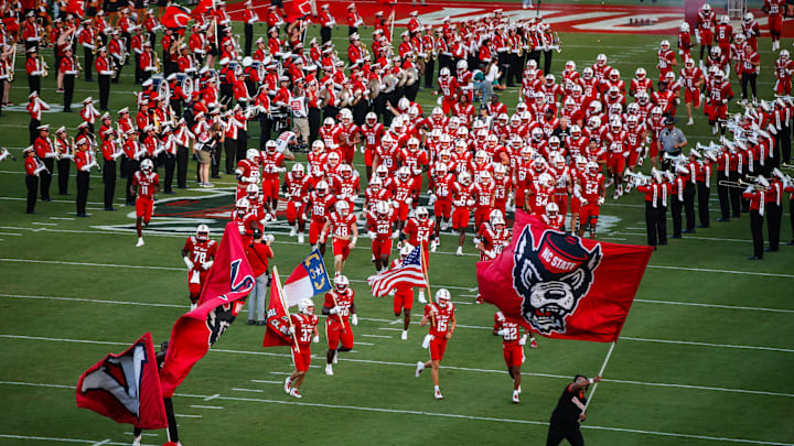 Aug 28, 2025; Raleigh, North Carolina, USA; North Carolina State Wolfpack runs out during the first half of the game against East Carolina Pirates at Carter-Finley Stadium. Mandatory Credit: Jaylynn Nash-Imagn Images Aug 28, 2025; Raleigh, North Carolina, USA; North Carolina State Wolfpack runs out during the first half of the game against East Carolina Pirates at Carter-Finley Stadium. Mandatory Credit: Jaylynn Nash-Imagn Images