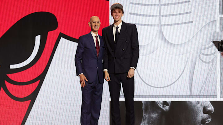 Jun 26, 2024; Brooklyn, NY, USA; Matas Buzelis poses for photos with NBA commissioner Adam Silver after being selected in the first round by the Chicago Bulls in the 2024 NBA Draft at Barclays Center. Mandatory Credit: Brad Penner-Imagn Images