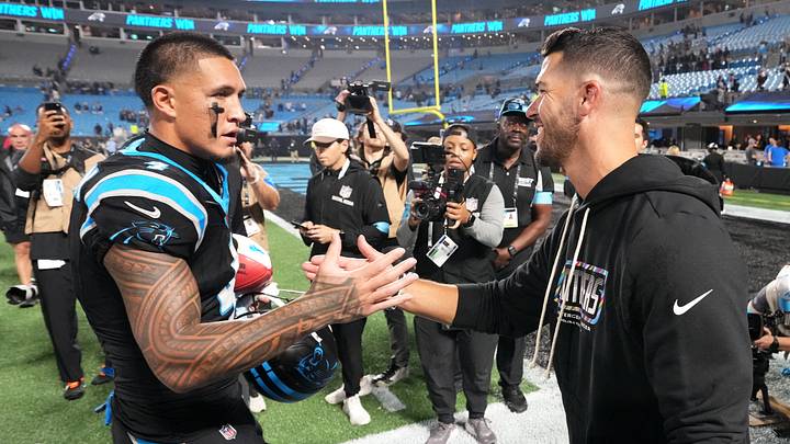 Carolina Panthers wide receiver Tetairoa McMillan (4) and head coach Dave Canales Carolina Panthers wide receiver Tetairoa McMillan (4) and head coach Dave Canales