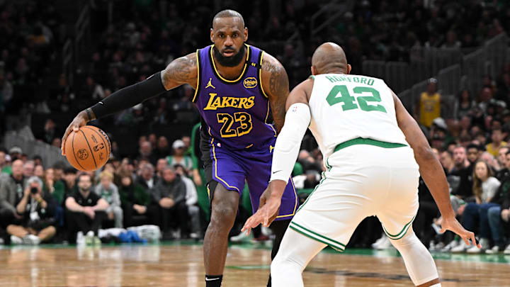 Mar 8, 2025; Boston, Massachusetts, USA; Los Angeles Lakers forward LeBron James (23) controls the ball against Boston Celtics center Al Horford (42) during the third quarter at the TD Garden. Mandatory Credit: Brian Fluharty-Imagn Images