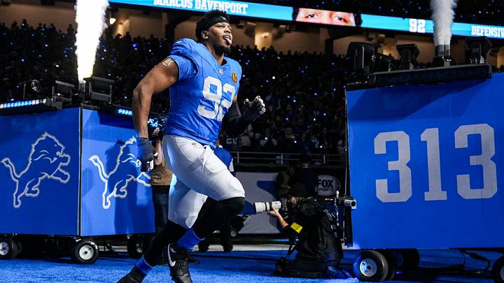 Detroit Lions defensive end Marcus Davenport (92) runs onto the field for players introduction before the Thanksgiving game against Green Bay Packers at Ford Field in Detroit on Thursday, Nov. 27, 2025. Detroit Lions defensive end Marcus Davenport (92) runs onto the field for players introduction before the Thanksgiving game against Green Bay Packers at Ford Field in Detroit on Thursday, Nov. 27, 2025.
