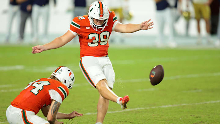 Aug 31, 2025; Miami Gardens, Florida, USA; Miami Hurricanes place kicker Carter Davis (39) kicks the game winning field goal against the Notre Dame Fighting Irish at Hard Rock Stadium. Mandatory Credit: Sam Navarro-Imagn Images