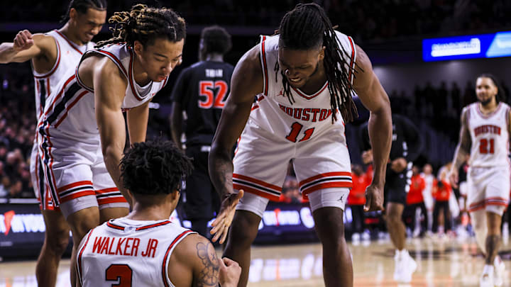 Jan 3, 2026; Cincinnati, Ohio, USA; Houston Cougars forward Joseph Tugler (11) reacts with guard Ramon Walker Jr. (3) after a play in the second half against the Cincinnati Bearcats at Fifth Third Arena. Mandatory Credit: Katie Stratman-Imagn Images