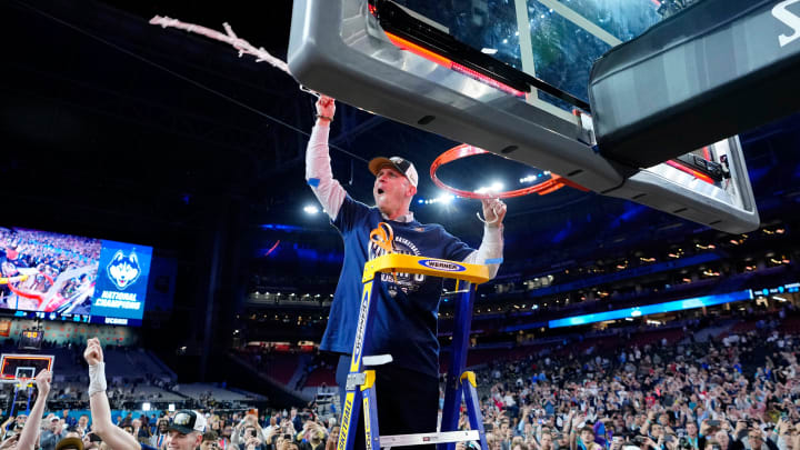 Connecticut Huskies head coach Dan Hurley cuts down the cut after defeating the Purdue Boilermakers in the national championship game of the Final Four of the 2024 NCAA Tournament at State Farm Stadium in Glendale on April 8, 2024. Connecticut Huskies head coach Dan Hurley cuts down the cut after defeating the Purdue Boilermakers in the national championship game of the Final Four of the 2024 NCAA Tournament at State Farm Stadium in Glendale on April 8, 2024.