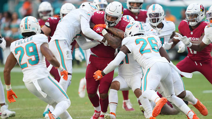 Arizona Cardinals running back James Conner (6) runs for a first down late in the fourth quarter against the Miami Dolphins at Hard Rock Stadium. Arizona Cardinals running back James Conner (6) runs for a first down late in the fourth quarter against the Miami Dolphins at Hard Rock Stadium.