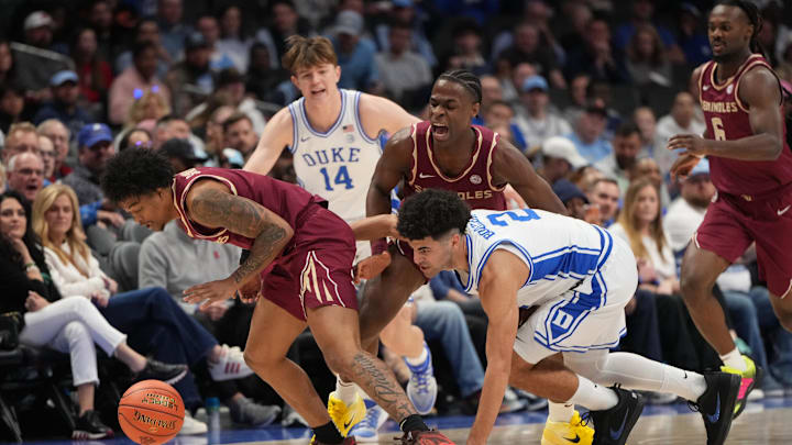 Mar 12, 2026; Charlotte, NC, USA; Florida State Seminoles guard Martin Somerville (1) takes the ball from Duke Blue Devils guard Cayden Boozer (2) as guard Thomas Bassong (3) helps defend in the first half at Spectrum Center. Mandatory Credit: Bob Donnan-Imagn Images