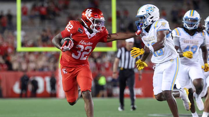 Sep 12, 2026; Houston, Texas, USA; Houston Cougars running back Nehemiah Warmate (32) runs with the ball during the fourth quarter against the Southern University Jaguars at TDECU Stadium. Mandatory Credit: Troy Taormina-Imagn Images Sep 12, 2026; Houston, Texas, USA; Houston Cougars running back Nehemiah Warmate (32) runs with the ball during the fourth quarter against the Southern University Jaguars at TDECU Stadium. Mandatory Credit: Troy Taormina-Imagn Images
