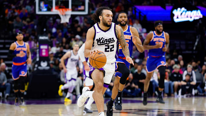Mar 10, 2025; Sacramento, California, USA; Sacramento Kings guard Devin Carter (22) dribbles the ball up the court against the New York Knicks during the fourth quarter at Golden 1 Center. Mandatory Credit: Sergio Estrada-Imagn Images