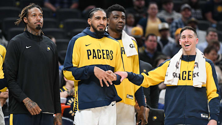 Mar 22, 2025; Indianapolis, Indiana, USA; Indiana Pacers forward James Johnson (16), forward Obi Toppin (1) and guard T.J. McConnell (9) watch from the bench during the second half against the Brooklyn Nets at Gainbridge Fieldhouse. Mandatory Credit: Robert Goddin-Imagn Images