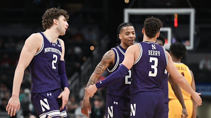 Mar 12, 2025; Indianapolis, IN, USA; Northwestern Wildcats guard K.J. Windham (24) and Northwestern Wildcats guard Ty Berry (3) celebrate after a play during the second half against the Minnesota Golden Gophers at Gainbridge Fieldhouse. Mandatory Credit: Robert Goddin-Imagn Images