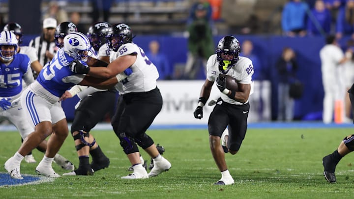 Nov 15, 2025; Provo, Utah, USA; Texas Christian University Horned Frogs running back Jeremy Payne (26) runs against the BYU Cougars during the second quarter at LaVell Edwards Stadium. Mandatory Credit: Rob Gray-Imagn Images