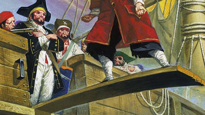 A prisoner walking plank on pirate ship