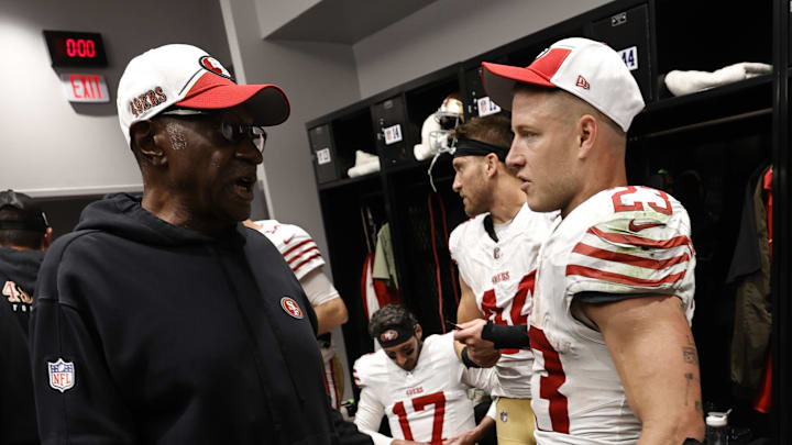 San Francisco 49ers running backs coach Bobby Turner (L) and running back Christian McCaffrey (R)