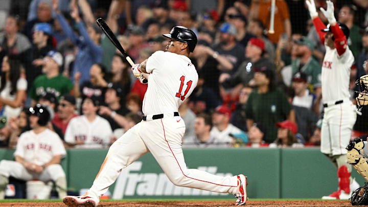 May 17, 2025; Boston, Massachusetts, USA; Boston Red Sox designated hitter Rafael Devers (11) hits a walk off home run against the Atlanta Braves during the ninth inning at Fenway Park. Mandatory Credit: Brian Fluharty-Imagn Images