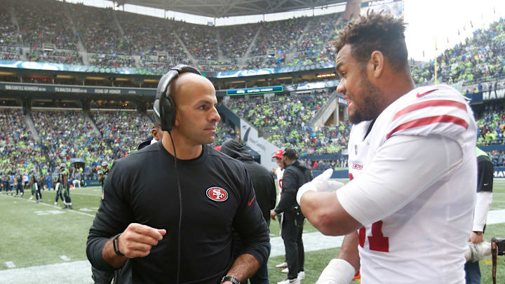 San Francisco 49ers defensive coordinator Robert Saleh (L) and defensive tackle Arik Armstead (right)