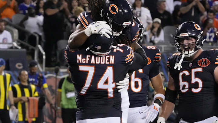 Aug 17, 2025; Chicago, Illinois, USA; Chicago Bears running back Ian Wheeler (33) celebrates his touchdown against the Buffalo Bills with guard Jordan McFadden (74) during the first half at Soldier Field. Mandatory Credit: David Banks-Imagn Images
