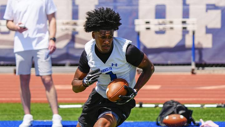 Chandler wide receiver Jai Jones (1) catches a passes and runs in a drill during spring football showcase at Chandler High School in Chandler on May 12, 2026. Chandler wide receiver Jai Jones (1) catches a passes and runs in a drill during spring football showcase at Chandler High School in Chandler on May 12, 2026.