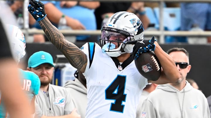 Oct 5, 2025; Charlotte, North Carolina, USA; Carolina Panthers wide receiver Tetairoa McMillan (4) signals first down in the second quarter at Bank of America Stadium. 