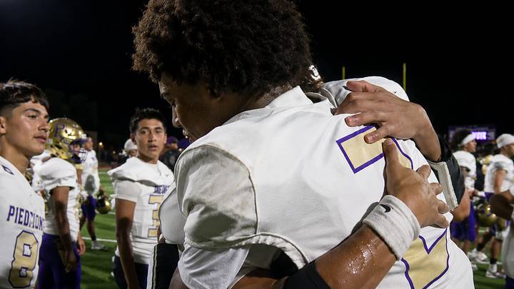 Miller's Laythan Wilson embraces a teammate after he scored on a game-winning 65-yard touchdown reception, on the final play of his team's 46-41 win over Flour Bluff. Miller's Laythan Wilson embraces a teammate after he scored on a game-winning 65-yard touchdown reception, on the final play of his team's 46-41 win over Flour Bluff.