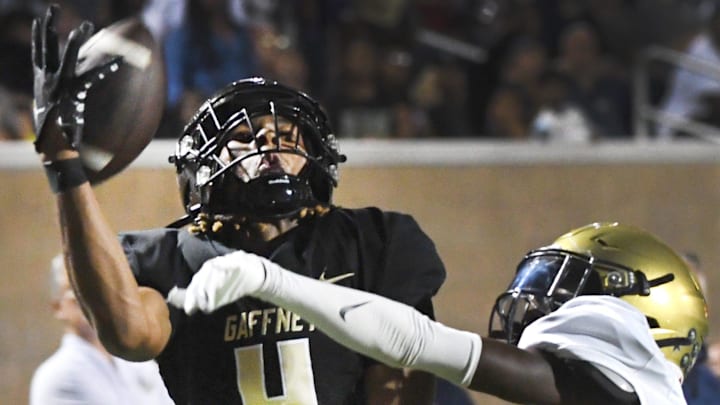 Gaffney played Spartanburg in high school football at Gaffney High School on Nov. 8, 2024. Gaffney wins the game 27-24. Gaffney's Shane Davidson (4) pulls down a ball with one hand to make the play.