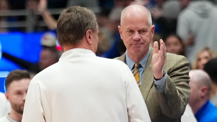 Feb 11, 2025; Lawrence, Kansas, USA; Colorado Buffaloes head coach Tad Boyle greets Kansas Jayhawks head coach Bill Self after the game at Allen Fieldhouse. Mandatory Credit: Denny Medley-Imagn Images