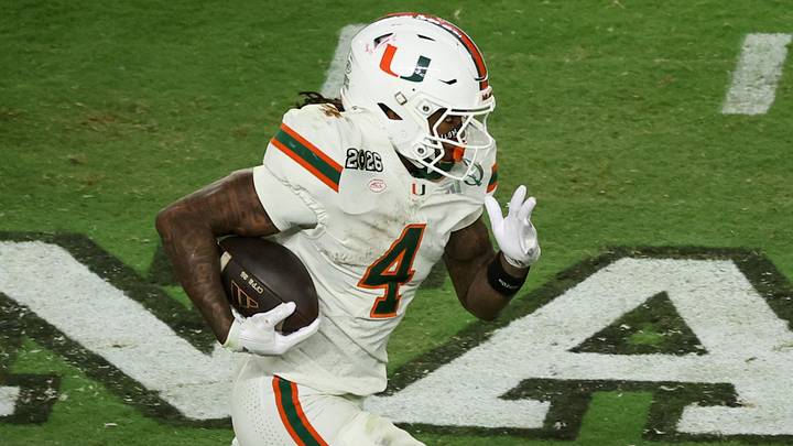 Jan 19, 2026; Miami Gardens, FL, USA; Miami Hurricanes running back Mark Fletcher Jr. (4) carries the ball against the Indiana Hoosiers in the third quarter during the College Football Playoff National Championship game at Hard Rock Stadium. Mandatory Credit: Kim Klement Neitzel-Imagn Images