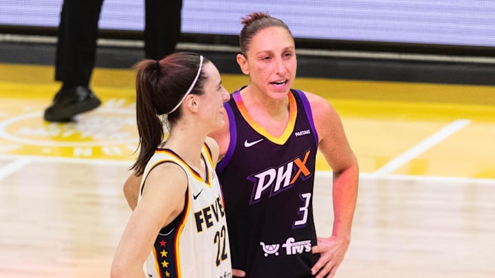 Indiana Fever guard Caitlin Clark (22) and Phoenix Mercury guard Diana Taurasi (3) talk at half court during a free throw on June 30, 2024, at Footprint Center in Phoenix. Indiana Fever guard Caitlin Clark (22) and Phoenix Mercury guard Diana Taurasi (3) talk at half court during a free throw on June 30, 2024, at Footprint Center in Phoenix.