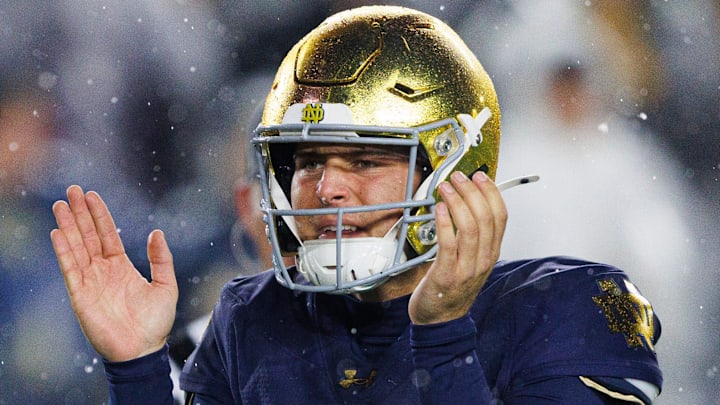 Notre Dame quarterback CJ Carr celebrates a touchdown pass  against Navy at Notre Dame Stadium.