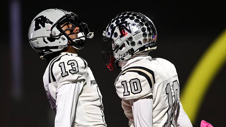 Pickerington North's Kymani Johnson (left) and Ethan Zananiri celebrate Johnson’s touchdown catch Oct. 24 2025, at Gahanna. (photo by John Hulkenberg)