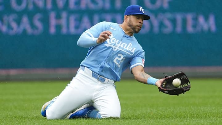 Kansas City Royals left fielder Tommy Pham (22) makes a sliding catch during the fifth inning against the San Francisco Giants at Kauffman Stadium. 